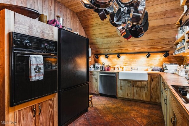 1000 Coon Fork Rd, Arnoldsburg, WV 25234 - kitchen featuring black appliances, wood walls, wooden ceiling, lofted ceiling, and dark tile patterned flooring