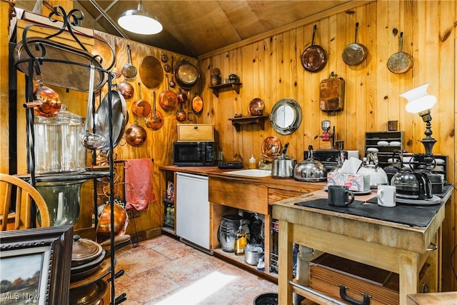 1000 Coon Fork Rd, Arnoldsburg, WV 25234 - kitchen featuring wooden walls, black microwave, stone finish flooring, and wood ceiling