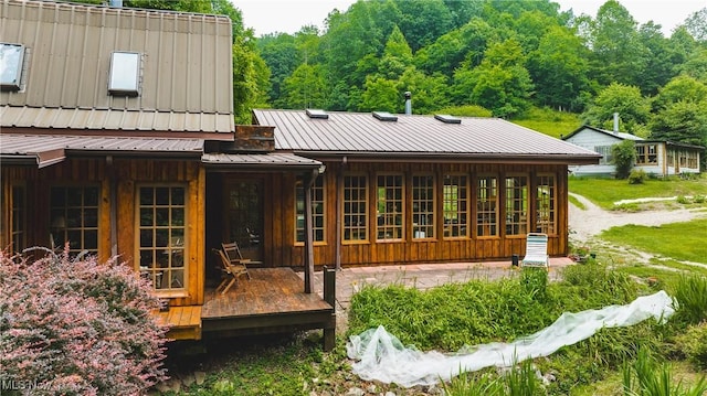 1000 Coon Fork Rd, Arnoldsburg, WV 25234 - rear view of property featuring a metal roof and board and batten siding