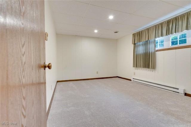 79 Windy Point Dr, Waterford, OH 45786 - empty room with baseboards, a baseboard heating unit, a paneled ceiling, and carpet