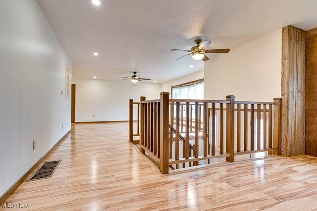 79 Windy Point Dr, Waterford, OH 45786 - hallway featuring an upstairs landing, light wood-type flooring, recessed lighting, baseboards, and visible vents