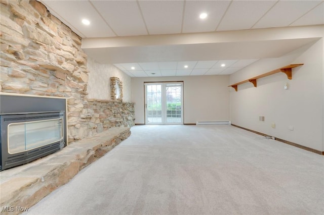79 Windy Point Dr, Waterford, OH 45786 - unfurnished living room with a baseboard radiator, baseboards, recessed lighting, a drop ceiling, and carpet floors