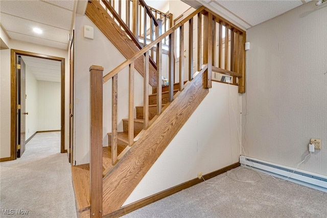 79 Windy Point Dr, Waterford, OH 45786 - staircase with carpet flooring, a baseboard radiator, and baseboards