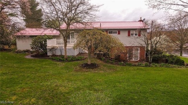 79 Windy Point Dr, Waterford, OH 45786 - back of property with a yard, a deck, and metal roof
