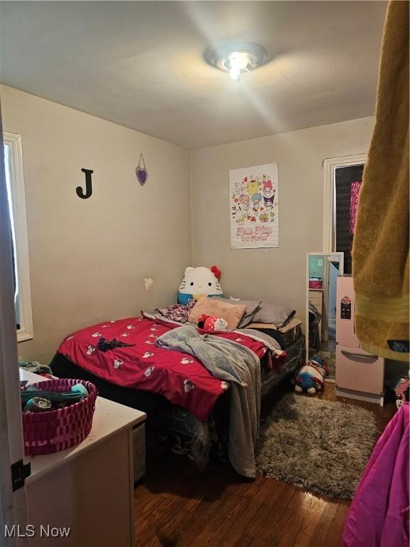 bedroom with wood finished floors