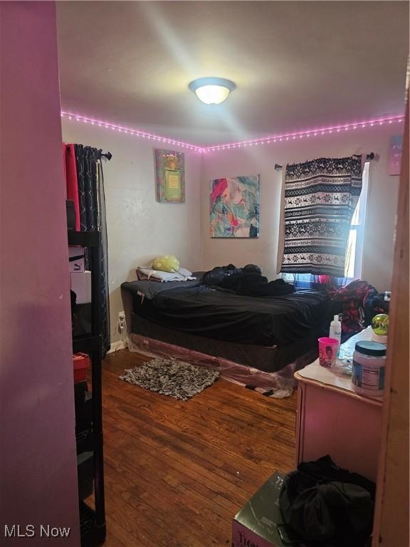 bedroom featuring wood finished floors