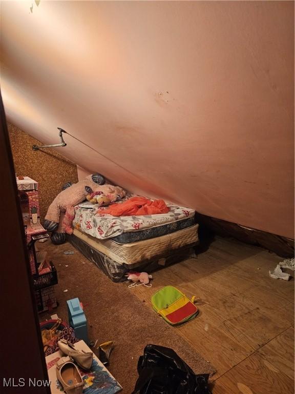 bedroom featuring lofted ceiling