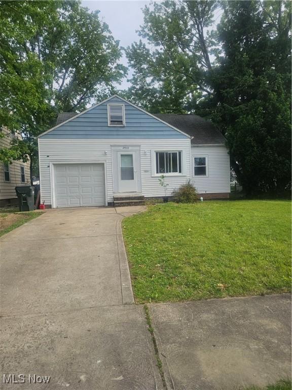 25100 Drakefield Ave, Euclid, OH 44132 - view of front of property featuring driveway, a front yard, and a garage