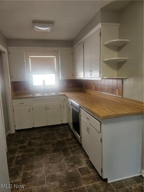 25100 Drakefield Ave, Euclid, OH 44132 - kitchen with white cabinetry, dark stone finish floors, and light countertops