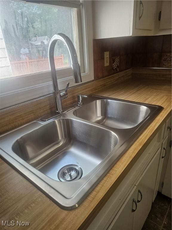 25100 Drakefield Ave, Euclid, OH 44132 - kitchen view of a sink and white cabinetry
