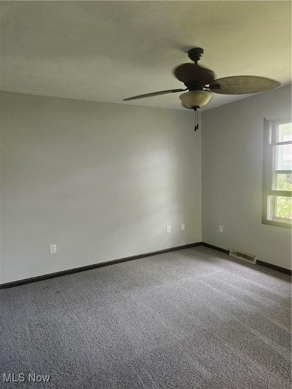 25100 Drakefield Ave, Euclid, OH 44132 - unfurnished room featuring a ceiling fan and carpet