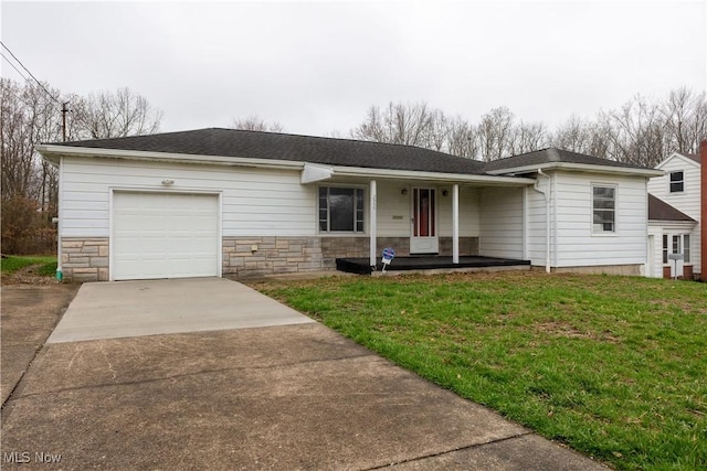 2955 Noel Dr, Youngstown, OH 44509 - ranch-style home featuring stone siding, an attached garage, a front lawn, driveway, and covered porch
