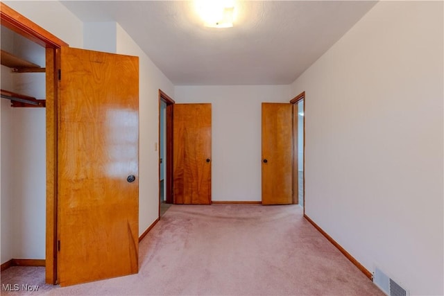 2955 Noel Dr, Youngstown, OH 44509 - unfurnished bedroom featuring baseboards, visible vents, a closet, and carpet floors
