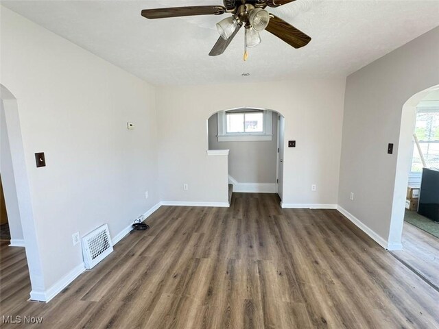 2106 17th St SW, Akron, OH 44314 - unfurnished room with arched walkways, ceiling fan, visible vents, and a healthy amount of sunlight