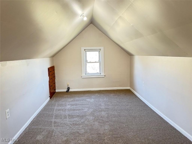 2106 17th St SW, Akron, OH 44314 - bonus room featuring baseboards, carpet flooring, and vaulted ceiling