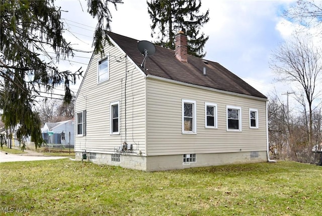 1118 Hartford Ave, Akron, OH 44320 - view of side of home with a chimney and a yard