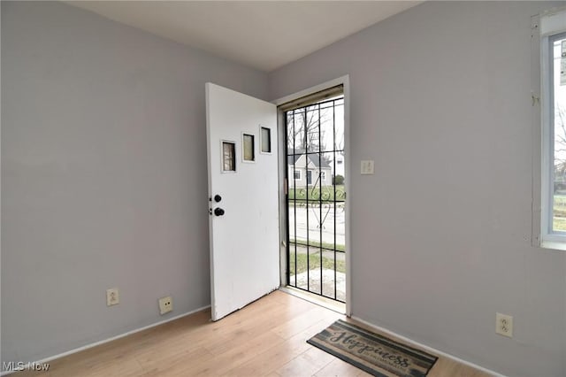 1118 Hartford Ave, Akron, OH 44320 - entryway featuring baseboards and light wood-style floors