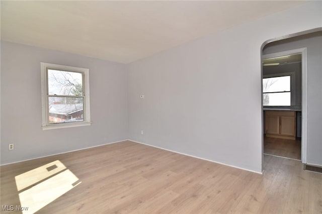 1118 Hartford Ave, Akron, OH 44320 - unfurnished room featuring light wood-style floors and a wealth of natural light