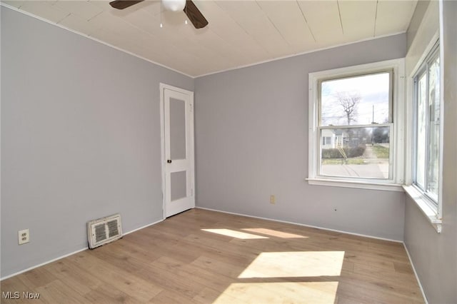 1118 Hartford Ave, Akron, OH 44320 - unfurnished room featuring wood finished floors, ornamental molding, ceiling fan, and visible vents