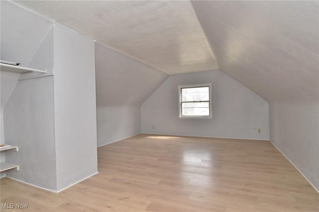 1118 Hartford Ave, Akron, OH 44320 - additional living space with lofted ceiling and light wood-style floors