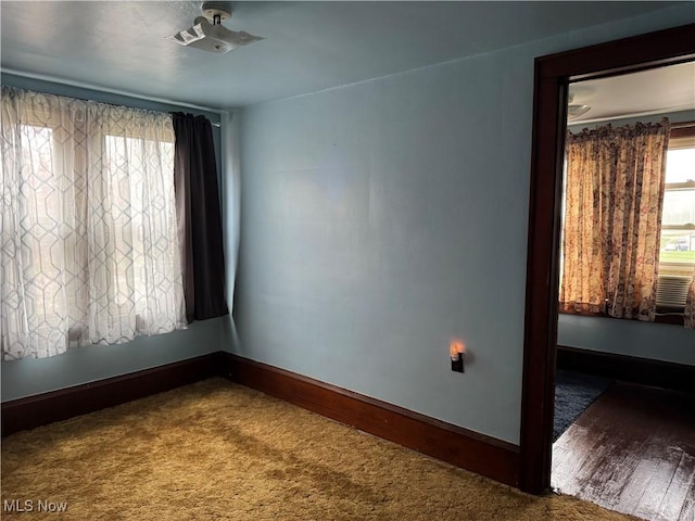 empty room with baseboards