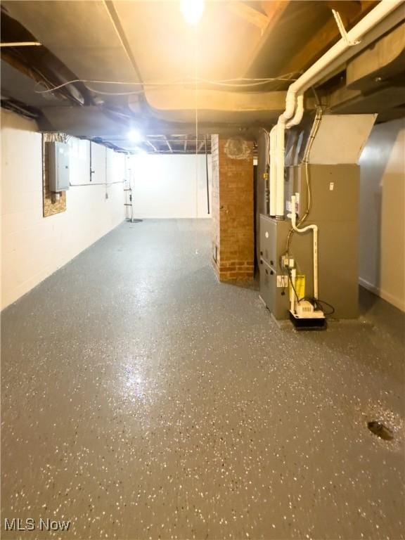 9171 Ridge Rd, North Royalton, OH 44133 - unfinished basement with electric panel and heating unit
