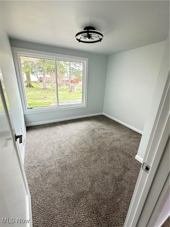 9171 Ridge Rd, North Royalton, OH 44133 - carpeted empty room with baseboards