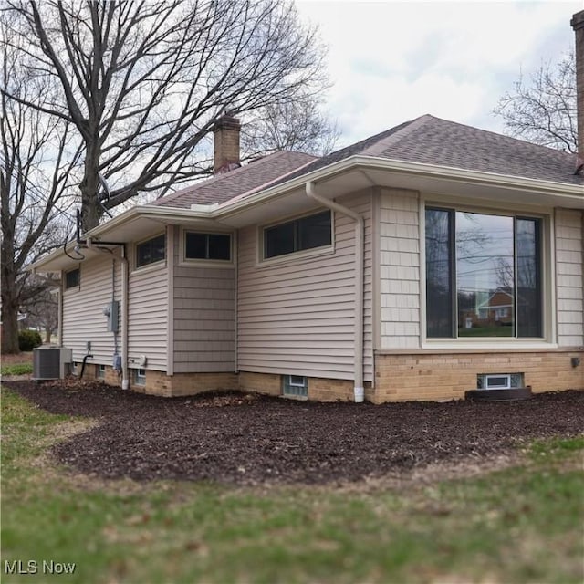 9171 Ridge Rd, North Royalton, OH 44133 - view of home's exterior with a chimney and a shingled roof