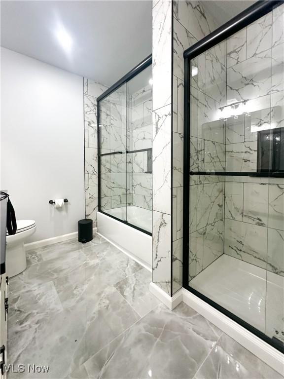 9171 Ridge Rd, North Royalton, OH 44133 - bathroom featuring marble finish flooring and enclosed tub / shower combo