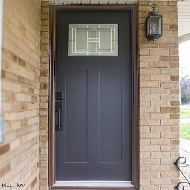9171 Ridge Rd, North Royalton, OH 44133 - view of exterior entry featuring brick siding