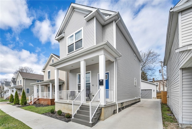 7510 Elton Ave, Cleveland, OH 44102 - view of front of property with a residential view, covered porch, an outdoor structure, and a detached garage