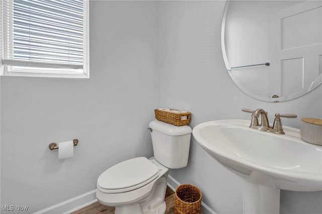 7510 Elton Ave, Cleveland, OH 44102 - bathroom with baseboards, toilet, and a sink