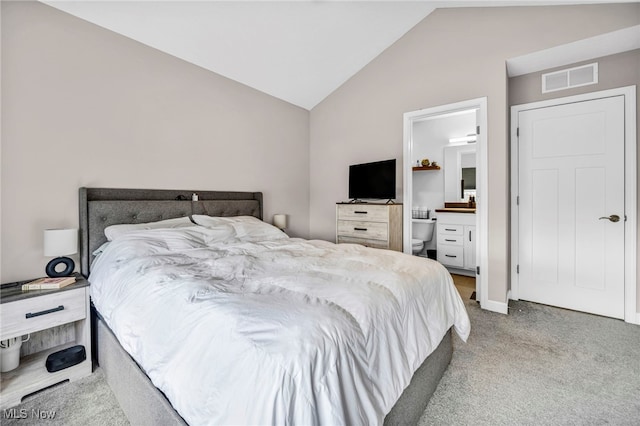 7510 Elton Ave, Cleveland, OH 44102 - carpeted bedroom featuring visible vents, lofted ceiling, and ensuite bathroom