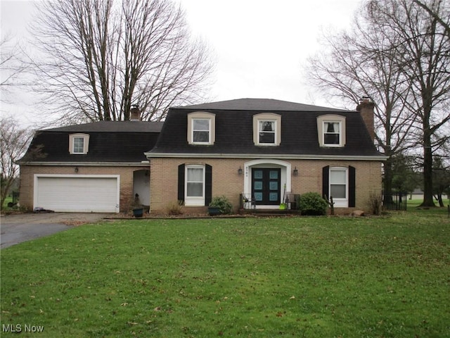3701 Villa Marie Rd, Lowellville, OH 44436 - view of front facade with driveway, a front lawn, brick siding, a shingled roof, and a chimney