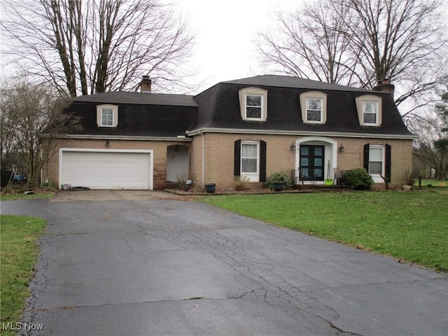 3701 Villa Marie Rd, Lowellville, OH 44436 - view of front of home with a chimney, brick siding, and driveway