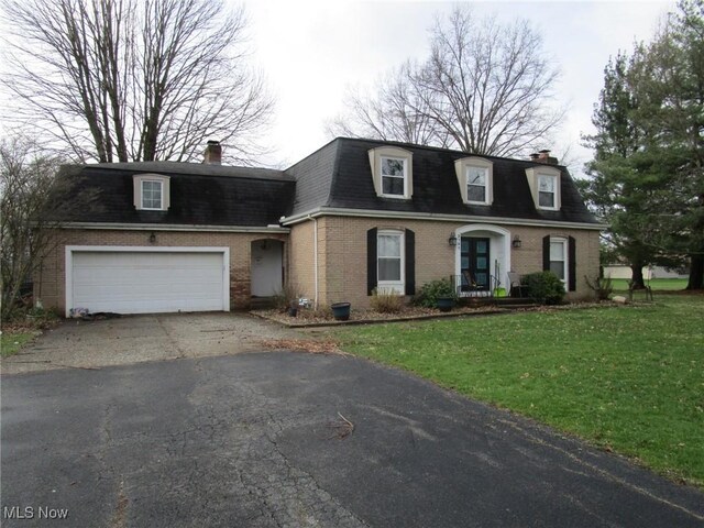 3701 Villa Marie Rd, Lowellville, OH 44436 - view of front of property featuring brick siding, driveway, mansard roof, and a chimney