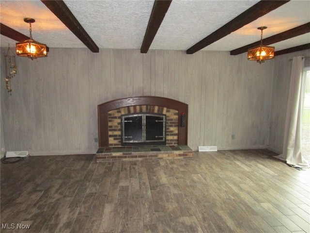 3701 Villa Marie Rd, Lowellville, OH 44436 - unfurnished living room with wood finished floors, beam ceiling, and a textured ceiling