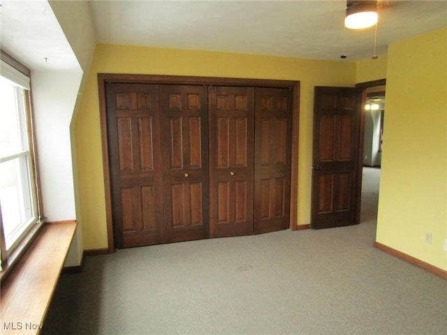 3701 Villa Marie Rd, Lowellville, OH 44436 - unfurnished bedroom featuring a closet, baseboards, multiple windows, and carpet