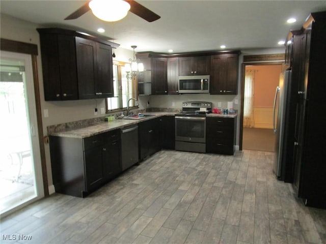 3701 Villa Marie Rd, Lowellville, OH 44436 - kitchen featuring light countertops, a sink, ceiling fan, light wood-style flooring, and appliances with stainless steel finishes