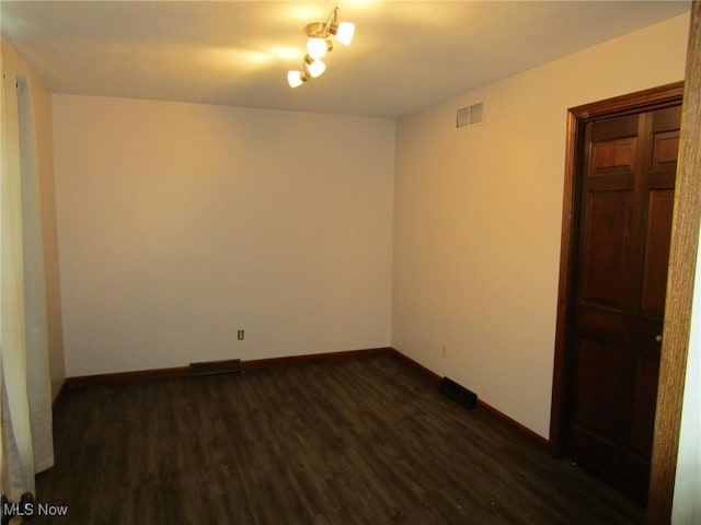 3701 Villa Marie Rd, Lowellville, OH 44436 - unfurnished room featuring baseboards, visible vents, and dark wood finished floors