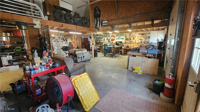 53525 Somerton Hwy, Jerusalem, OH 43747 - miscellaneous room featuring a workshop area and unfinished concrete flooring