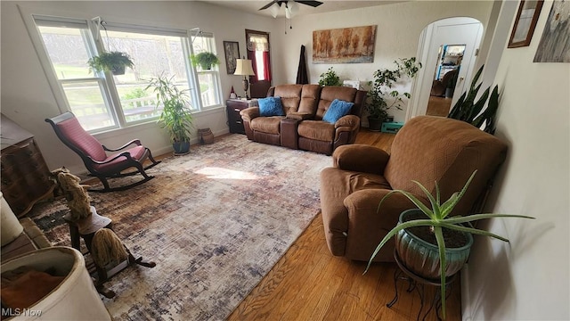 53525 Somerton Hwy, Jerusalem, OH 43747 - living area featuring wood finished floors, arched walkways, and ceiling fan