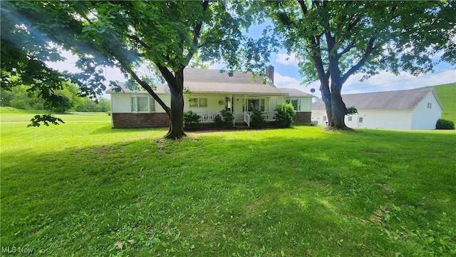 53525 Somerton Hwy, Jerusalem, OH 43747 - view of front of house with a chimney, a front lawn, and a porch