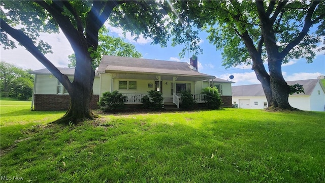 53525 Somerton Hwy, Jerusalem, OH 43747 - view of front of house featuring a chimney, a front yard, covered porch, brick siding, and a garage