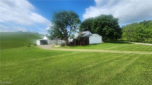 53525 Somerton Hwy, Jerusalem, OH 43747 - view of green lawn featuring a carport and an outbuilding