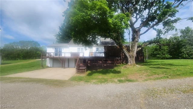 53525 Somerton Hwy, Jerusalem, OH 43747 - view of front of property featuring concrete driveway, an attached garage, a front lawn, and a wooden deck