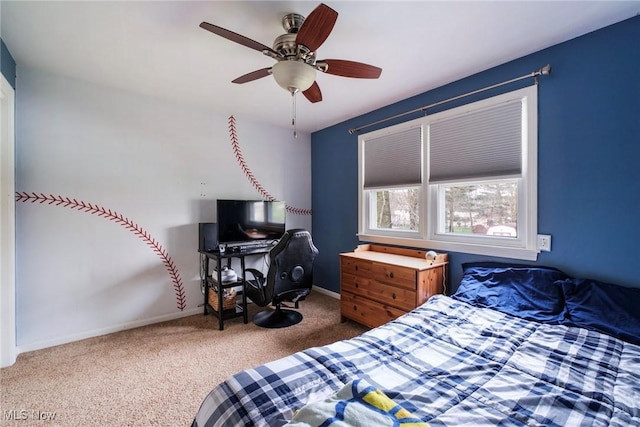 carpeted bedroom featuring baseboards and a ceiling fan