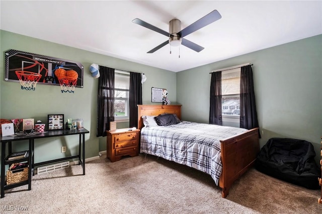 bedroom featuring carpet floors, a ceiling fan, and visible vents