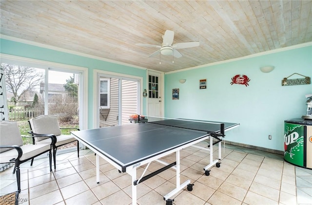 recreation room featuring a ceiling fan, light tile patterned floors, ornamental molding, and wood ceiling