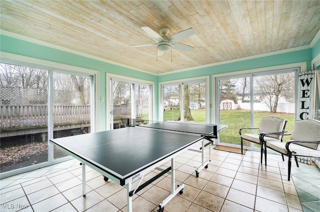 game room featuring wooden ceiling, a ceiling fan, tile patterned floors, and ornamental molding